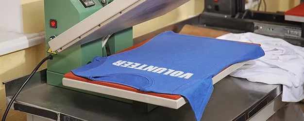 Photo of shirt being screen printed